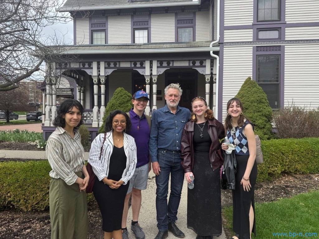Bill Pullman and students standing in front of Fasano House at Alfred University